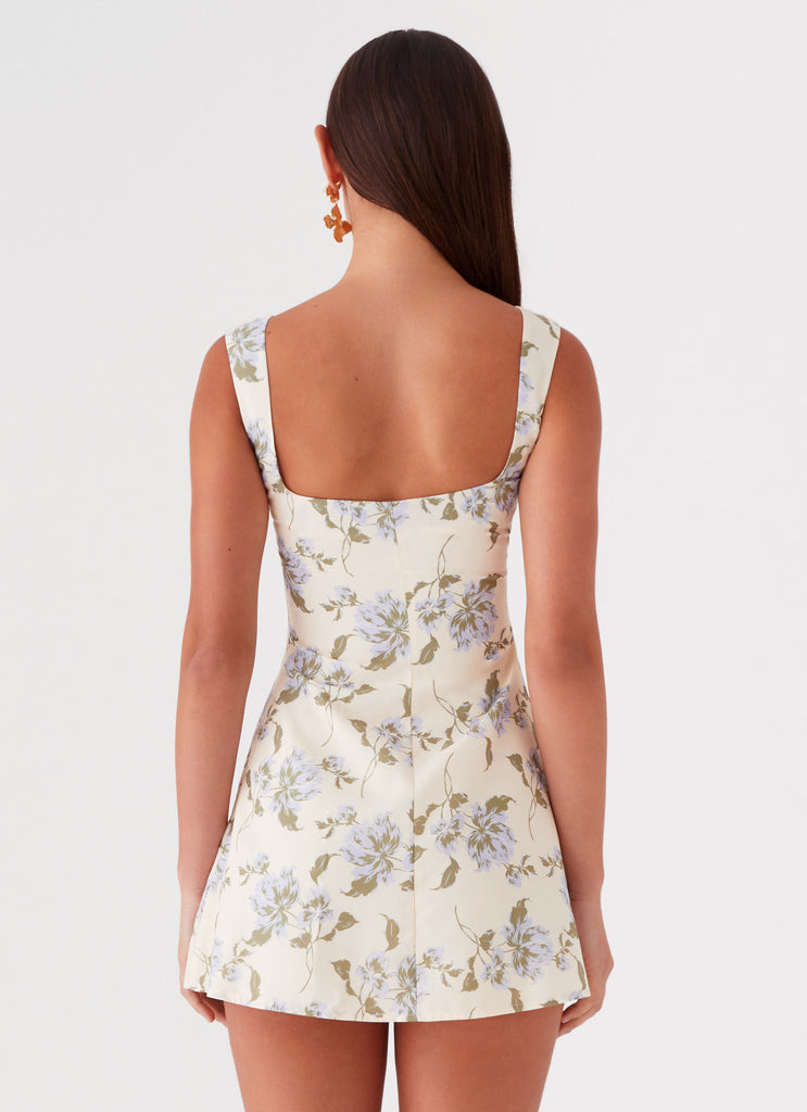 Womens Cadence Mini Dress in the colour Yellow Purple Floral in front of a light grey background