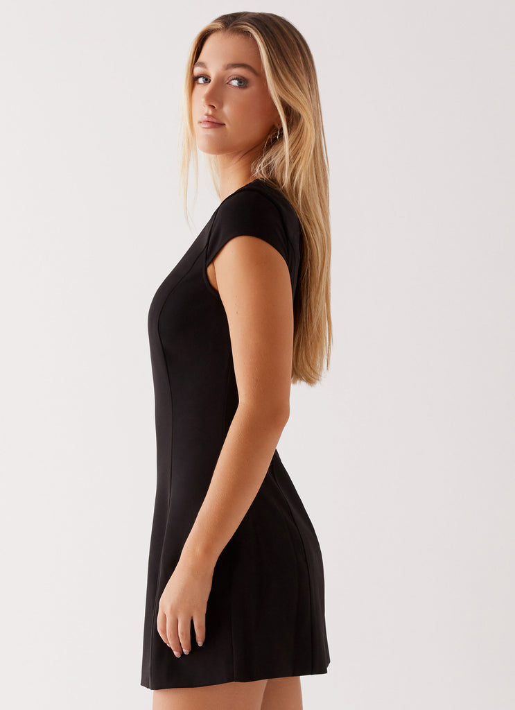 Womens Tia Mini Dress in the colour Black in front of a light grey background