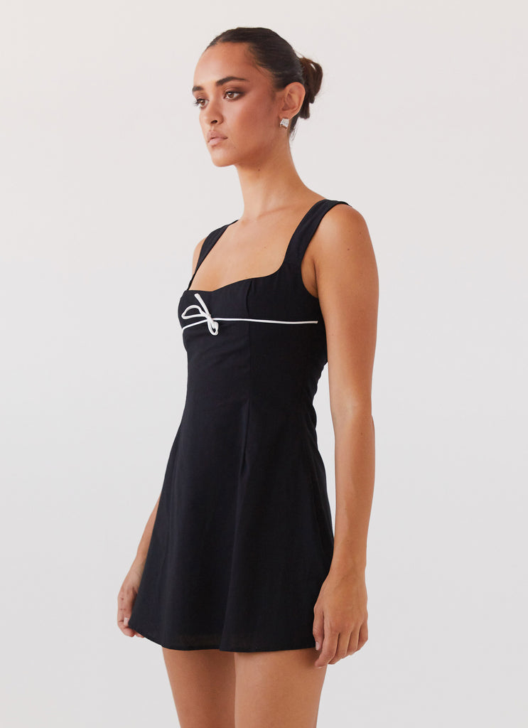 Womens Cadence Mini Dress in the colour Black in front of a light grey background