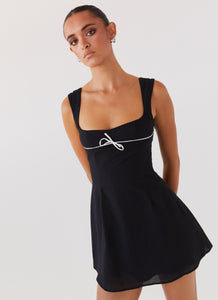 Womens Cadence Mini Dress in the colour Black in front of a light grey background