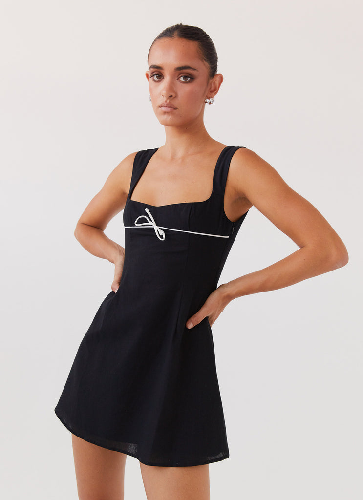 Womens Cadence Mini Dress in the colour Black in front of a light grey background